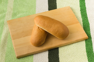 two bread lies on a board