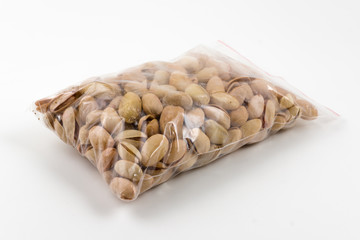 transparent plastic package full of dry pistachios