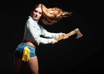 Sexy strong woman feminist with axe working.