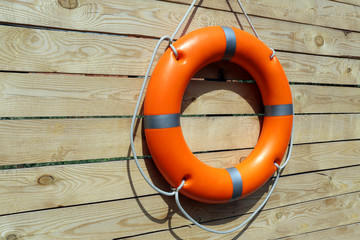 A life buoy on wooden background