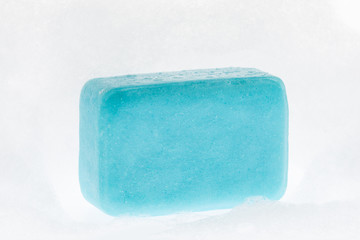blue soap with foam on white background