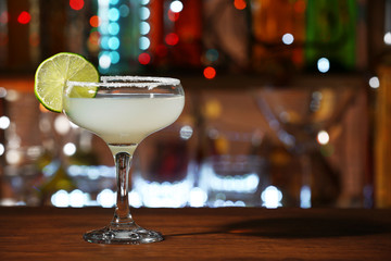 Glass of cocktail on the bar counter