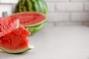 Sliced watermelons on brick wall background