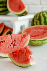 Sliced watermelons on brick wall background