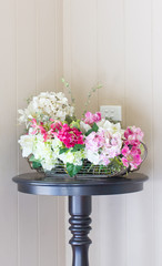 Plastic flowers with modern vase.
