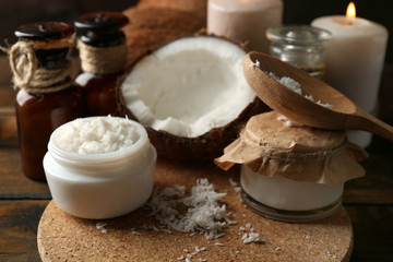 Spa coconut products on dark wooden background
