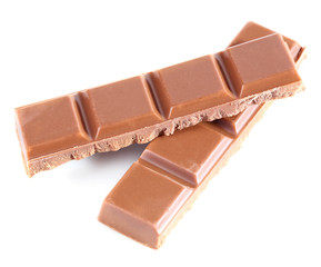 Milk chocolate pieces isolated on white background