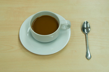 a cup of coffee with spoon