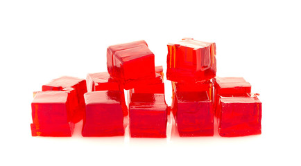 Cubes of red jelly on a white background