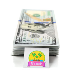 Pack with many hundred dollars for vacation, isolated on white