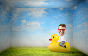 Businessman on rubber duck