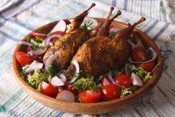 delicious fried quail and fresh vegetables close-up. horizontal
