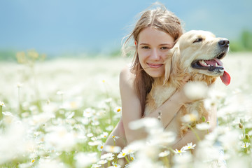 Beautiful girl with dog friend in a wild nature 