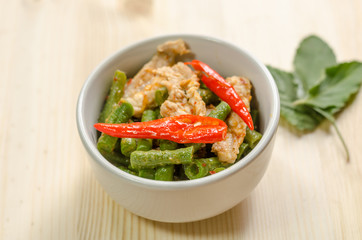 Spicy stir fried pork with red curry paste and Yard Long bean, T