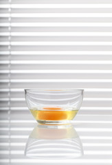 Egg yolk in a glass bowl