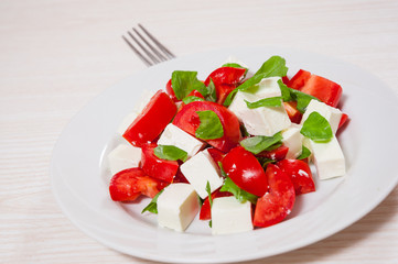salad with cheese, tomatoes and basil