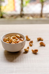 cashew nuts on wooden background