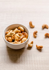 Close up cashew nuts on wooden background
