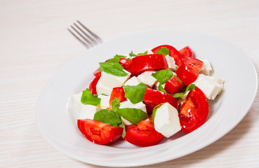 salad with cheese, tomatoes and basil