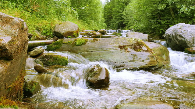 Beautiful stones in a mountain stream.  Panorama. 4K 3840x2160. 