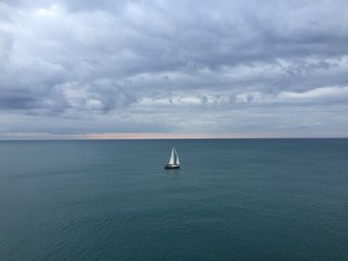 The boat between sky and sea