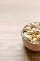 Close up Pistachios Nuts on wooden background