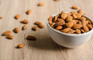 Almond Nuts on wooden background