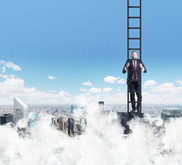 A businessman is climbing up the ladder. Clouds and New York view. The concept of the success.