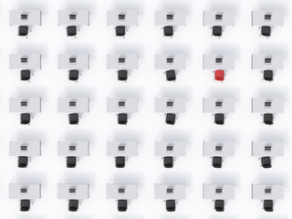 A top view of the symmetric corporate workplaces on white floor. A concept of corporate life. Black leather chairs, white tables and modern laptops. A one chair is a red. 3D rendering.