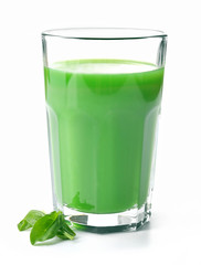 Glass of spinach juice isolated on white