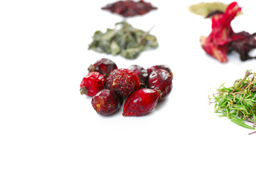 Various kinds of herbal tea and herbs isolated on white