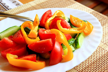 fresh vegetable salad with tomato, cucumber and sweet pepper