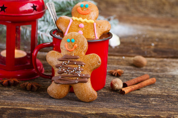 Gingerbread men with mug of hot chocolate