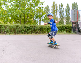 Young boy showing off on his skateboard