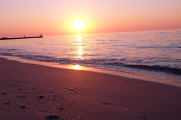 Fototapeta na wymiar View of beautiful sunrise on the beach