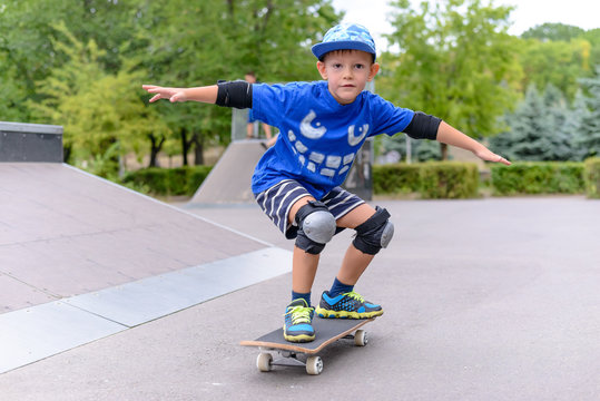 Young boy showing off on his skateboard
