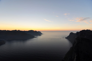 Obraz premium Norwegian nature / There are mountains plunging into the sea from hundreds of metres, fjords, tall mountain peaks, northern lights and midnight sun.