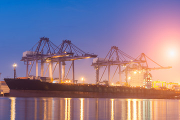 Fototapeta na wymiar Containers loading by crane on morning dark