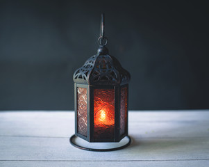 Metal lantern with space on dark background © sirirak