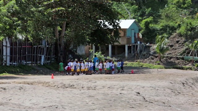 Soufriere St Lucia school children exercise on beach HD 1576