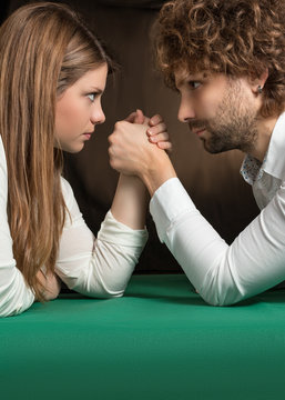 challenge of arm wrestling between man and woman