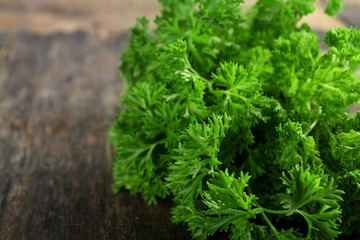 Fresh parsley on wooden background