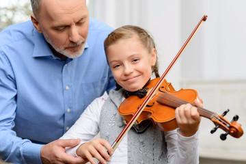 Nice girl playing the violin 