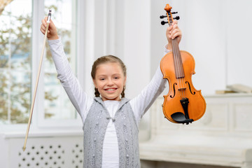 Nice girl playing the violin 