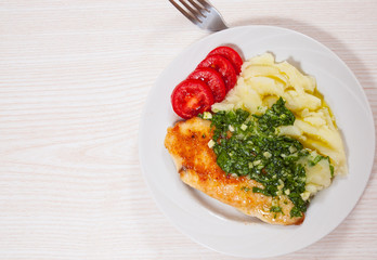Roasted chicken breast with pesto sauce and mashed potatoes