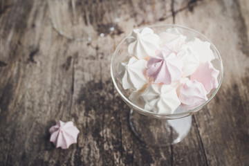pink and white meringue cookies, top view, selective focus