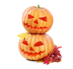 Halloween pumpkin head jack lantern with burning candles isolated on white background