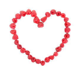 Heart shaped raspberries isolated on white