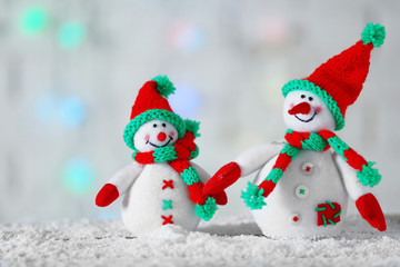 Cute snowmen on Christmas background