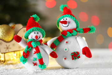 Cute snowmen on Christmas background